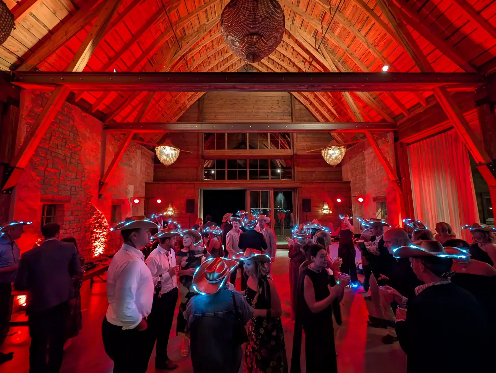 Wedding reception at Copper Rose Ranch with red lighting